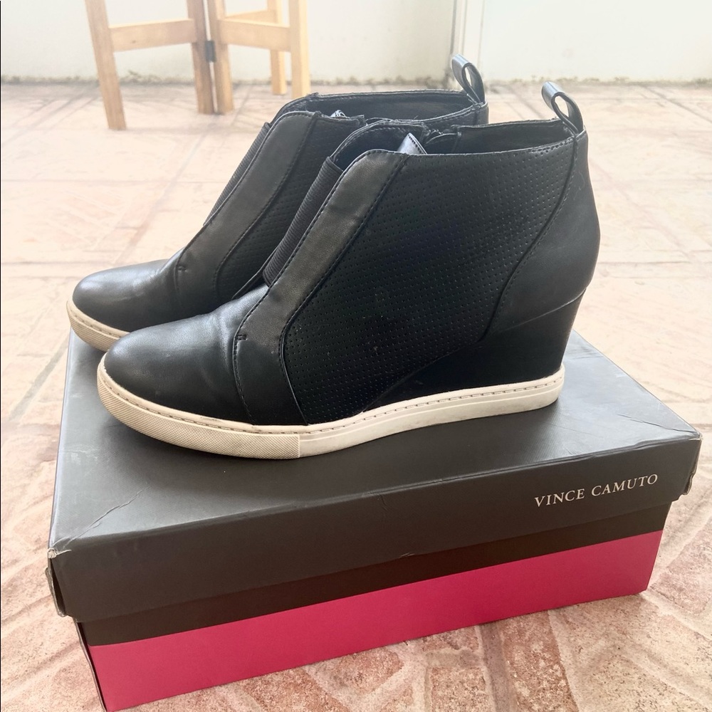 Women’s black wedge ankle booties.